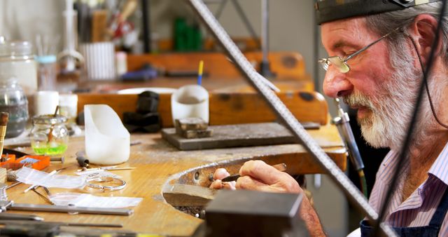 Skilled Craftsman Working with Hand Tools in a Jewelry Workshop - Download Free Stock Images Pikwizard.com