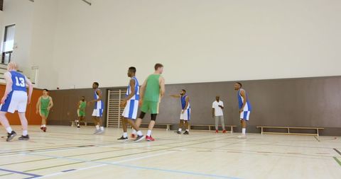 Intense Basketball Scrimmage Action in Indoor Gym