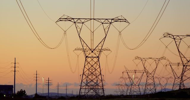 Electricity pylons during sunset at countryside 4k