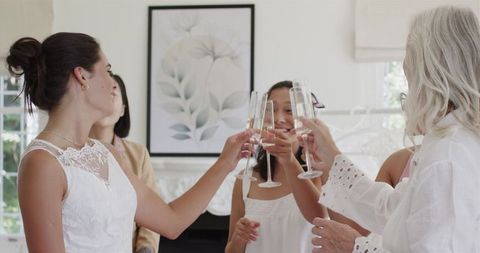 Bride Toasting with Friends in Premise of Wedding Prep Directors of Wedding