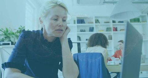 Professional woman focused on work in a modern office
