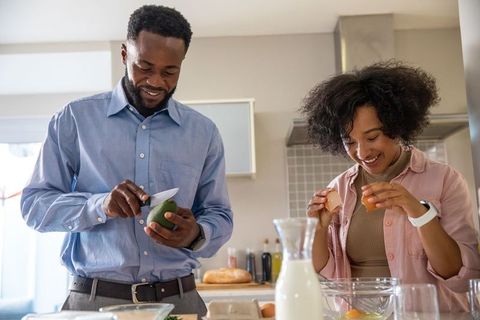 African American Couple Cooking Together in Modern Kitchen Setting