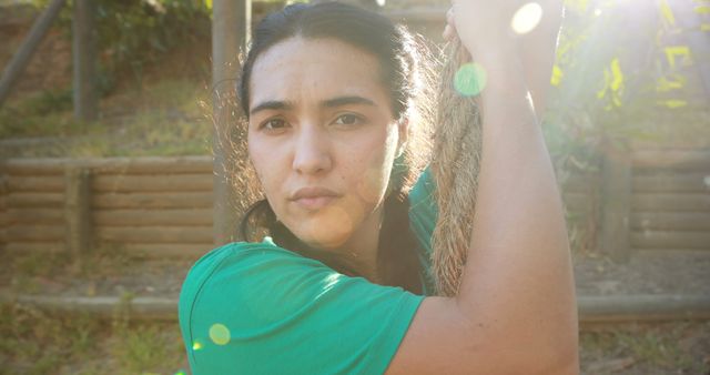 Athletic Young Woman Holding Rope Outside with Sunlight in Background - Download Free Stock Images Pikwizard.com