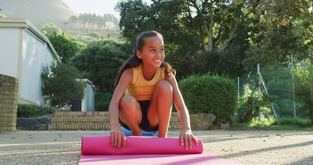 Young Girl Rolling Out Yoga Mat Outdoor Fitness - Download Free Stock Images Pikwizard.com