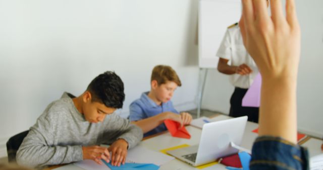 Students Engaged in Origami with Teacher in Classroom Setting - Download Free Stock Images Pikwizard.com