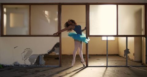 Ballet Dancer Practicing in Abandoned Warehouse