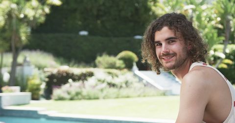 Happy Young Man Relaxing by Pool on Sunny Day - Download Free Stock Images Pikwizard.com