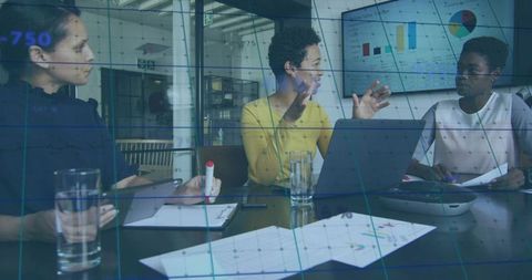 Business Team Collaborating in Modern Office with Technology and Charts