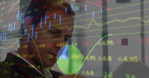 Businessman Analyzing Stock Market Trends in Office - Download Free Stock Images Pikwizard.com