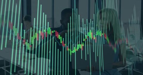Business Team Analyzing Financial Charts on Laptop with Stock Market Overlay in Modern Office