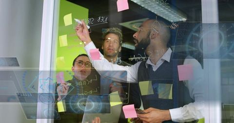 Team Collaboration with Digital Overlay and Sticky Notes at Office Glass Wall