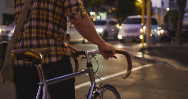 Urban Cyclist Walking Bike on Busy Evening Street - Download Free Stock Images Pikwizard.com