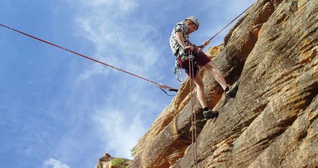 Man Rock Climbing on Sunny Day with Safety Gear - Download Free Stock Images Pikwizard.com