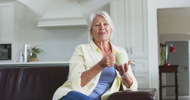 Relaxed Senior Woman Drinking Coffee in Modern Kitchen - Download Free Stock Images Pikwizard.com