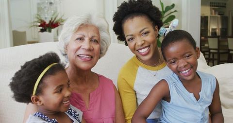 African American Family Generations Smiling Together on Couch