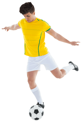 Focused soccer player kicking ball on transparent background
