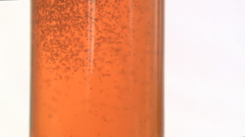 Close-Up Bubbles in Apple Juice in Slow Motion