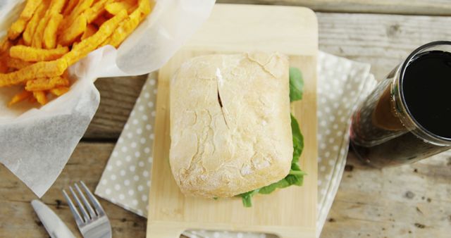 Tasty Deli Sandwich with Sweet Potato Fries and Cola on Wooden Table - Download Free Stock Images Pikwizard.com