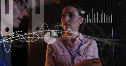 Two professionals discussing technology and data analytics