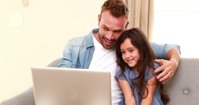 Father and Daughter Smiling While Using Laptop at Home - Download Free Stock Images Pikwizard.com