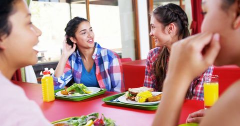 Diverse Friends Enjoying Meal Together Reflecting Joyful Connection - Download Free Stock Images Pikwizard.com