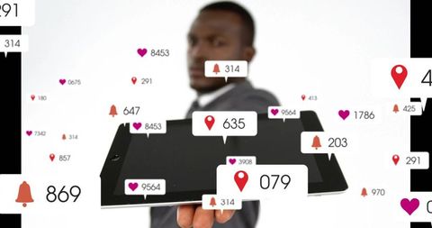 Businessman holding tablet with social media notifications, likes and location pins