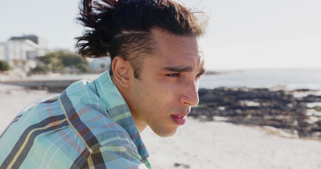 Contemplative Man with Under-Cut Hairstyle at Beach - Download Free Stock Images Pikwizard.com