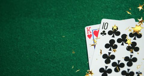 Playing Cards with Digital Star Effects on Green Felt Background - Download Free Stock Images Pikwizard.com