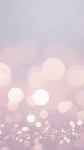 Shimmering bokeh lights dancing over pastel pink lavender backdrop vertical video loop