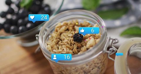Organic Granola in Jar with Digital Likes Icons on Rustic Counter