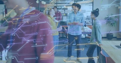 Team Collaborating in Tech-Driven Open Office with Augmented Reality Circuit Overlay Scene