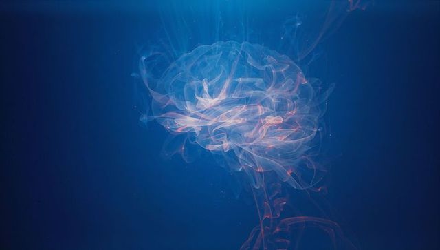 Glowing Translucent Brain Illustration in Deep Blue Setting