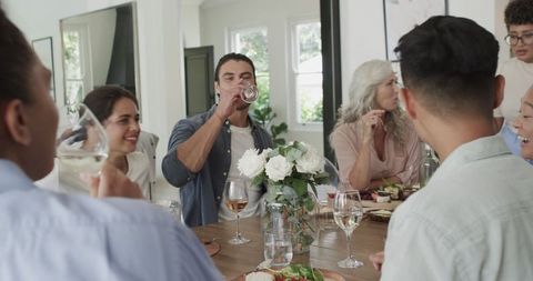 Friends Celebrating with Drinks at Wedding Reception
