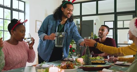 Diverse Friends Enjoying Festive Dinner with Roast Chicken