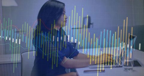 Businesswoman Analyzing Data with Digital Graph Overlay in Office