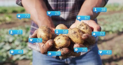 Farmer holding potatoes with social media engagement