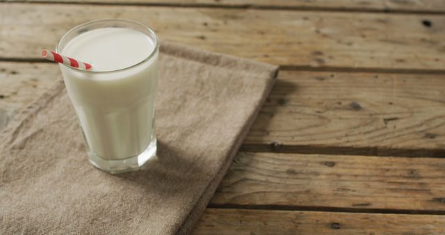 Image of glass of fresh milk on wooden background. dairy products and healthy organic nutrition.