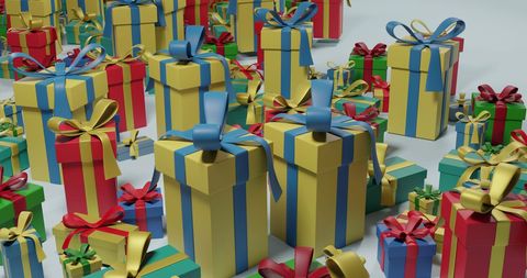 Colorful christmas presents with satin ribbons on grey background