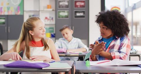 Diverse Schoolchildren Learning Sign Language in Classroom