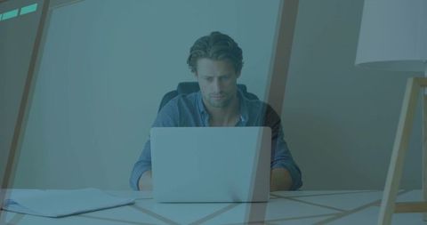 Focused office professional typing at minimalist desk