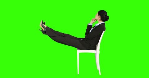 Business Woman Reflecting with Legs Stretched on Chair - Download Free Stock Images Pikwizard.com