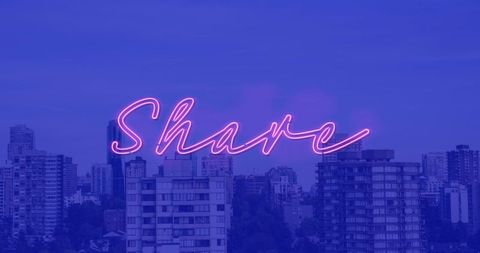Neon Share Sign Over Urban Cityscape at Dusk
