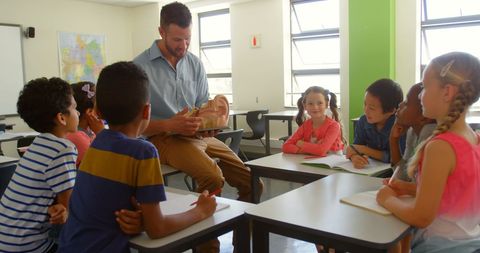 Teacher Explaining Anatomy Model to Attentive School Children - Download Free Stock Images Pikwizard.com