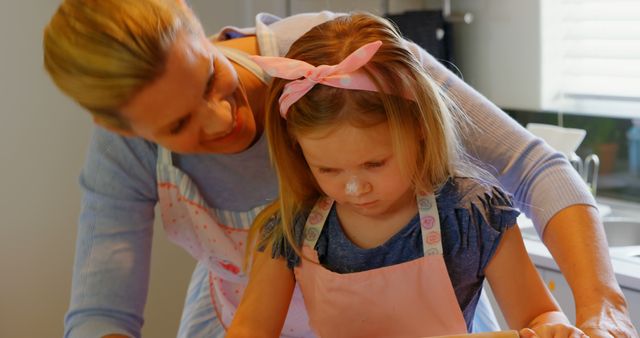 Caucasian Mother and Daughter Baking in Kitchen Rolling Dough Together, Family Lifestyle - Download Free Stock Images Pikwizard.com