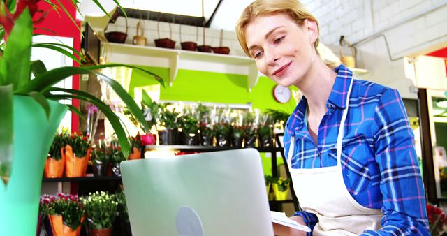 Flower Shop Owner Managing Business on Laptop - Download Free Stock Images Pikwizard.com