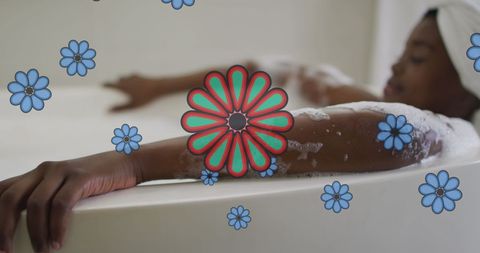 Relaxed african american woman enjoying bubble bath at home