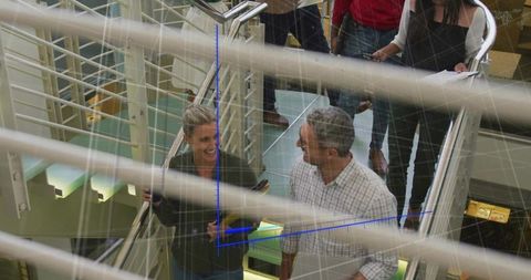 Business Professionals on Office Staircase Elevating Ideas