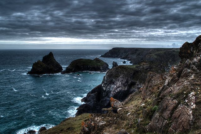 Dramatic Coastal Cliffs and Rough Seas Under Overcast Sky - Download Free Stock Photos Pikwizard.com