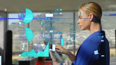 Businesswoman Using Tablet with Digital Graph Overlays in Modern Office