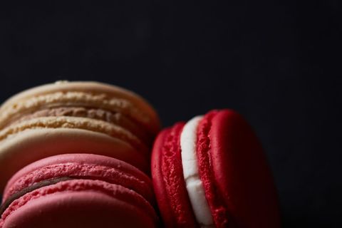 Close-Up of Pretty Assorted Macarons Against Dark Background